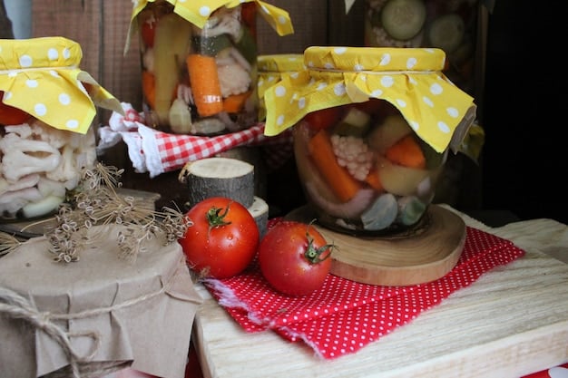 A variety of colorful beeswax wraps covering different food items like fruits, vegetables, and bowls, displayed on a wooden countertop.