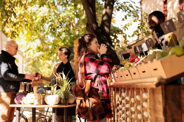 A bustling local farmers market with vendors selling fresh produce, artisanal products, and handmade crafts. The scene highlights the vibrant atmosphere and community support of local businesses.