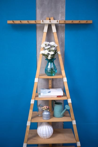 A creatively repurposed ladder transformed into a stylish shelving unit. The ladder is painted in a vibrant color and leans against a wall, displaying a variety of potted plants, books, and decorative items. This upcycling project adds a touch of rustic charm and functionality to the living space.