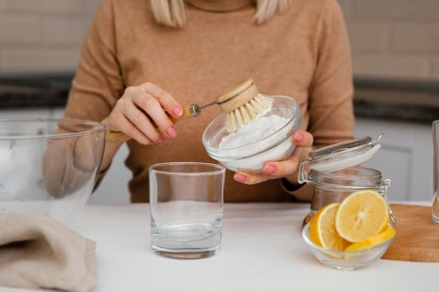 A person mixing ingredients in a glass bowl to create a DIY eco-friendly cleaning solution. Various natural ingredients like lemon halves, baking soda, and essential oil bottles are arranged around the bowl.