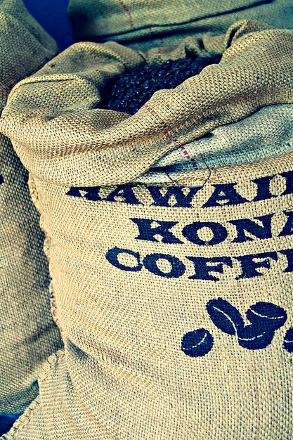 Close-up of a fair trade certified coffee bag with detailed information about the origin, farming practices, and labor standards.