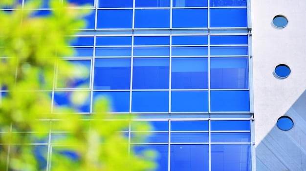 A close-up of BIPV solar panels integrated into a building's facade, emphasizing the seamless integration with the glass and metal structure. The panels are dark and reflective, blending with the building's design while highlighting sustainable energy generation.