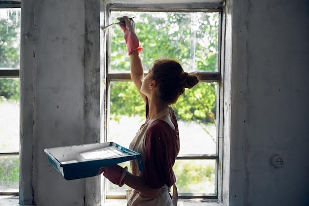 A person applying caulk around a window frame to seal air leaks, demonstrating a simple DIY home improvement project for energy efficiency.
