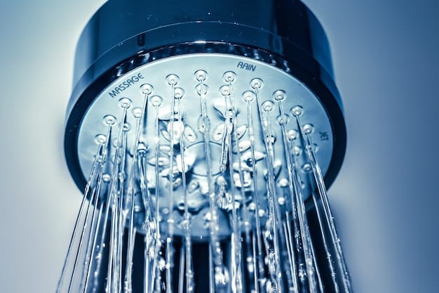 Close-up of a low-flow showerhead in use, demonstrating water conservation technology in the bathroom.