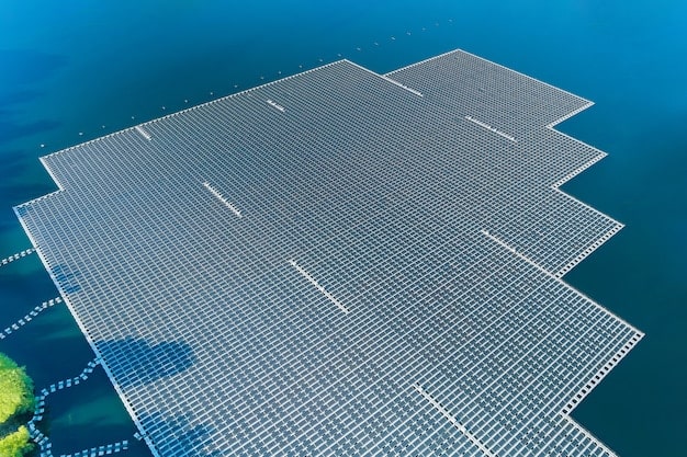 A diagram illustrating the components of a floating solar farm, including the solar panels, pontoons, mooring system, and underwater cables. Labels clearly identify each component.