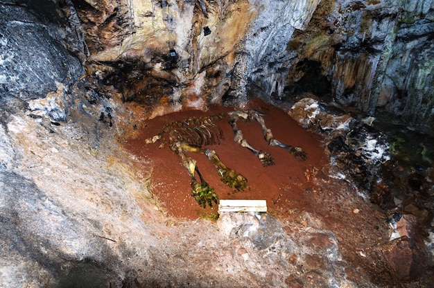 A depiction of a secure underground geological storage site for captured CO2, showing the process of injecting CO2 into deep rock formations and monitoring its long-term containment.