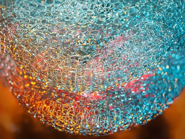 A close-up, microscopic view of the crystalline structure of a perovskite material, highlighting its unique arrangement of atoms and molecules. The image is highly detailed, showcasing the intricate lattice structure and the composition of the material.