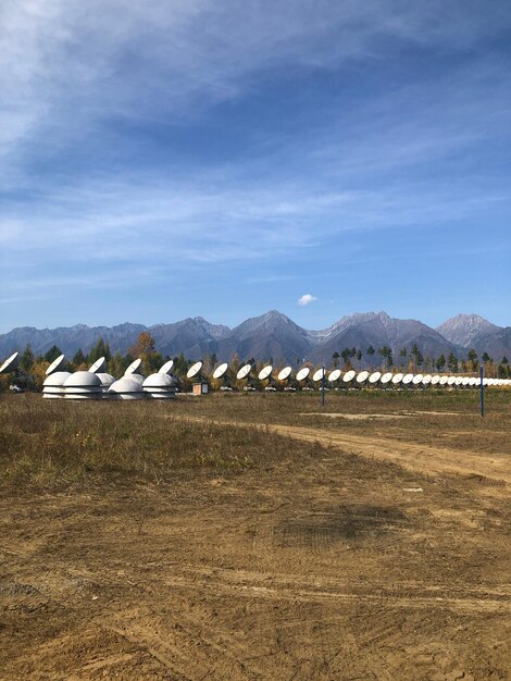 A solar farm in the desert, with rows of solar panels stretching out to the horizon under a clear blue sky, symbolizing the potential for large-scale renewable energy generation.