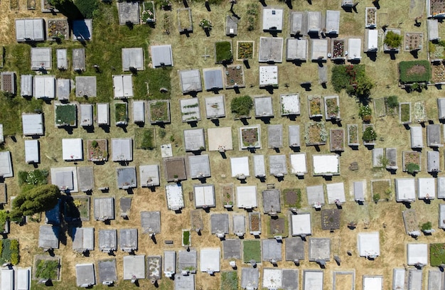 An aerial view of a community powered by a microgrid, showcasing solar panels on rooftops, battery storage systems, and the central control hub, all integrated to provide a reliable and sustainable energy source.