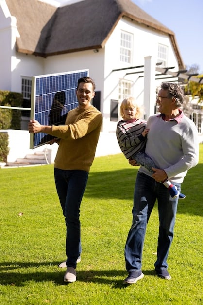 A family standing in front of their home with solar panels on the roof, smiling and pointing towards the panels.