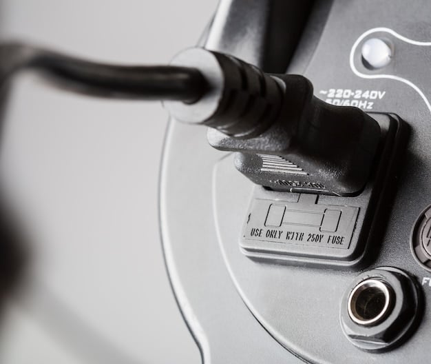 A detailed close-up of a charging connector being plugged into an electric vehicle. The vehicle is parked at a public charging station, and the display screen on the charger shows charging information. The focus is on the connection point and the clean, modern design of the charging equipment.
