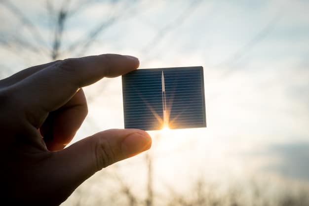 A close-up shot of a hand holding a miniature solar panel, with a backdrop of a graph showing the growth of solar energy investments over the past decade.