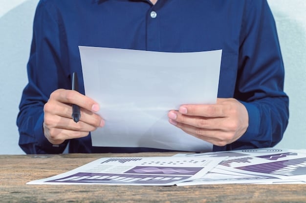 A close-up of a hand holding a document titled 