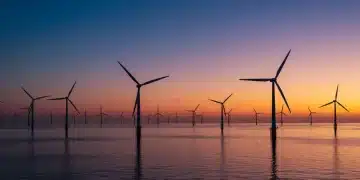 Offshore wind farm at sunrise symbolizing renewable energy growth in the US.