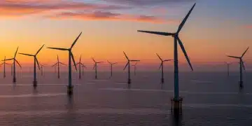 US offshore wind turbines: 2025 trends & tech advancements Offshore wind farm at sunrise, symbolizing US renewable energy growth